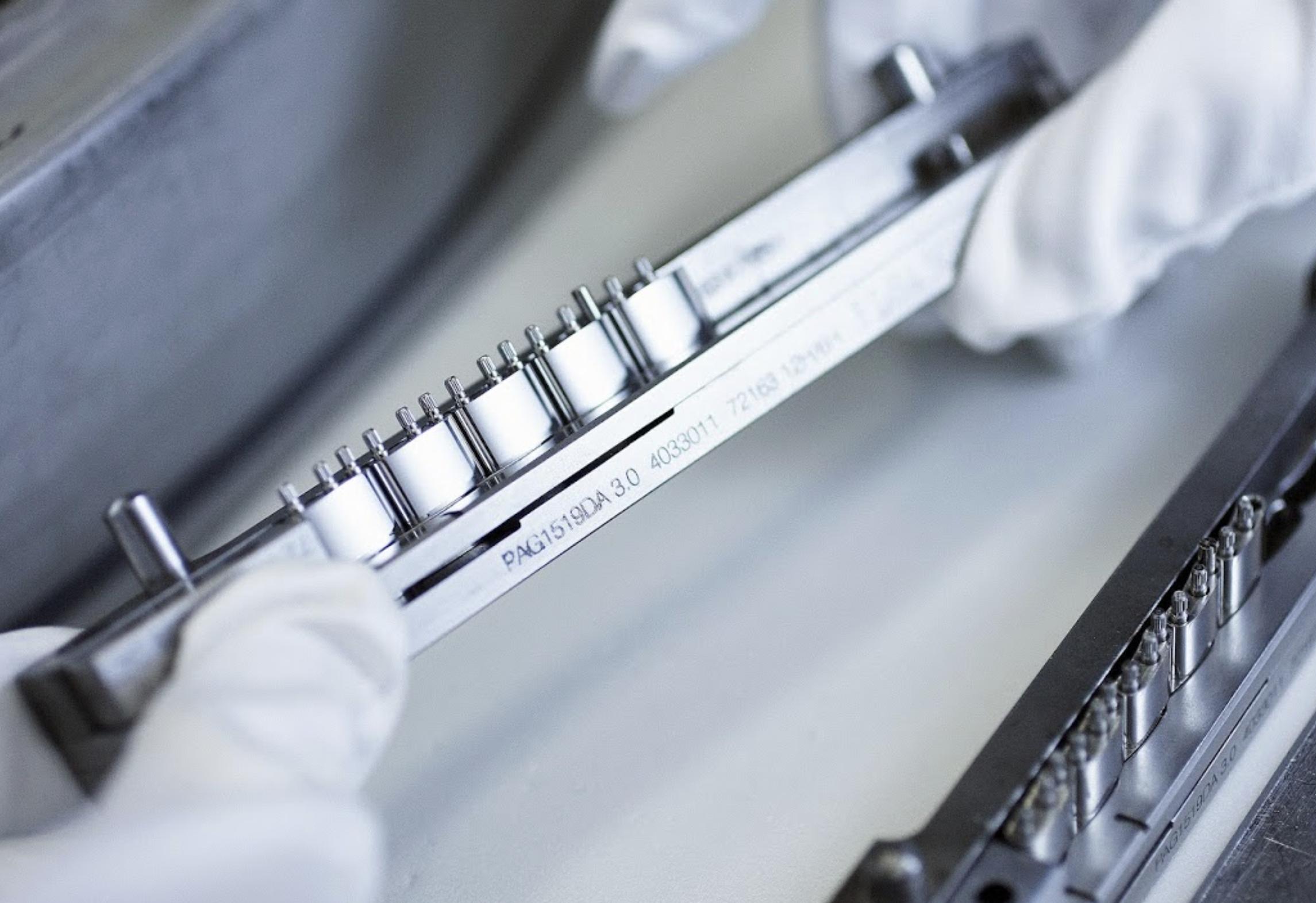 Master craftsman manufacturing a precision Rolex bracelet